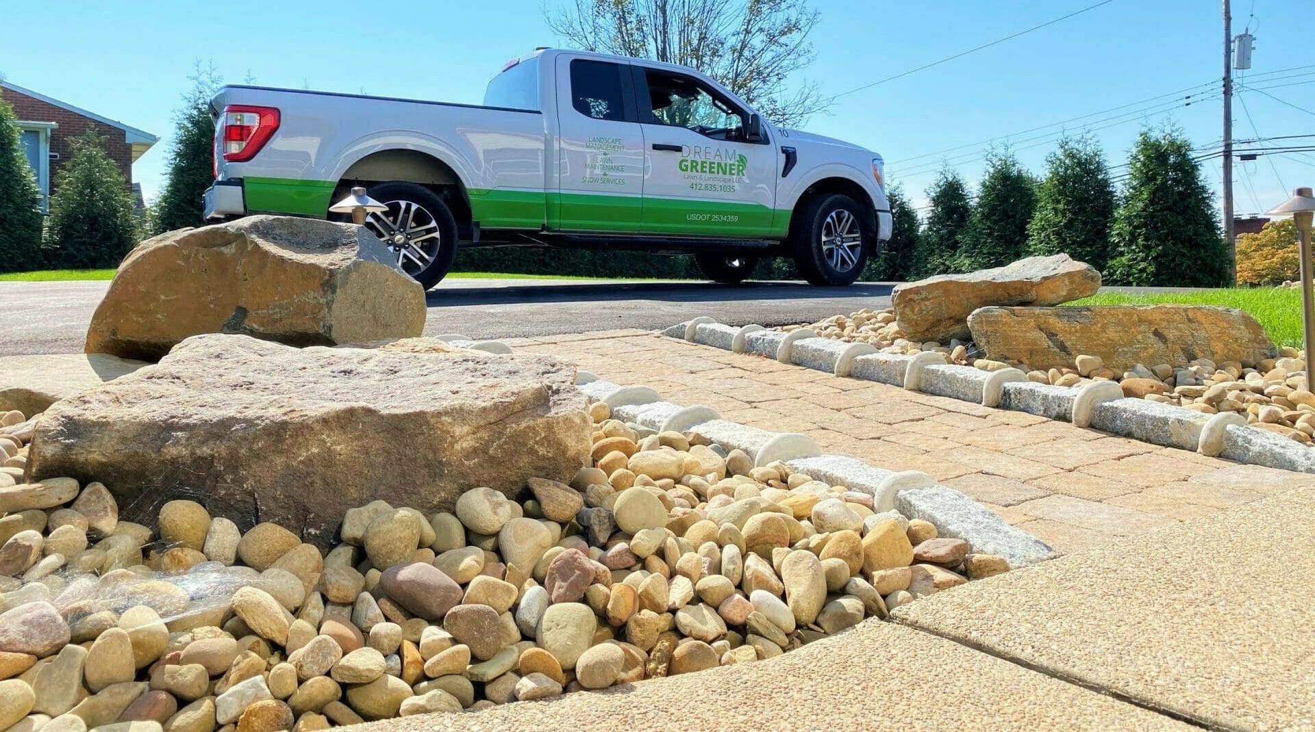 hardscape pathway with dream greener truck 
