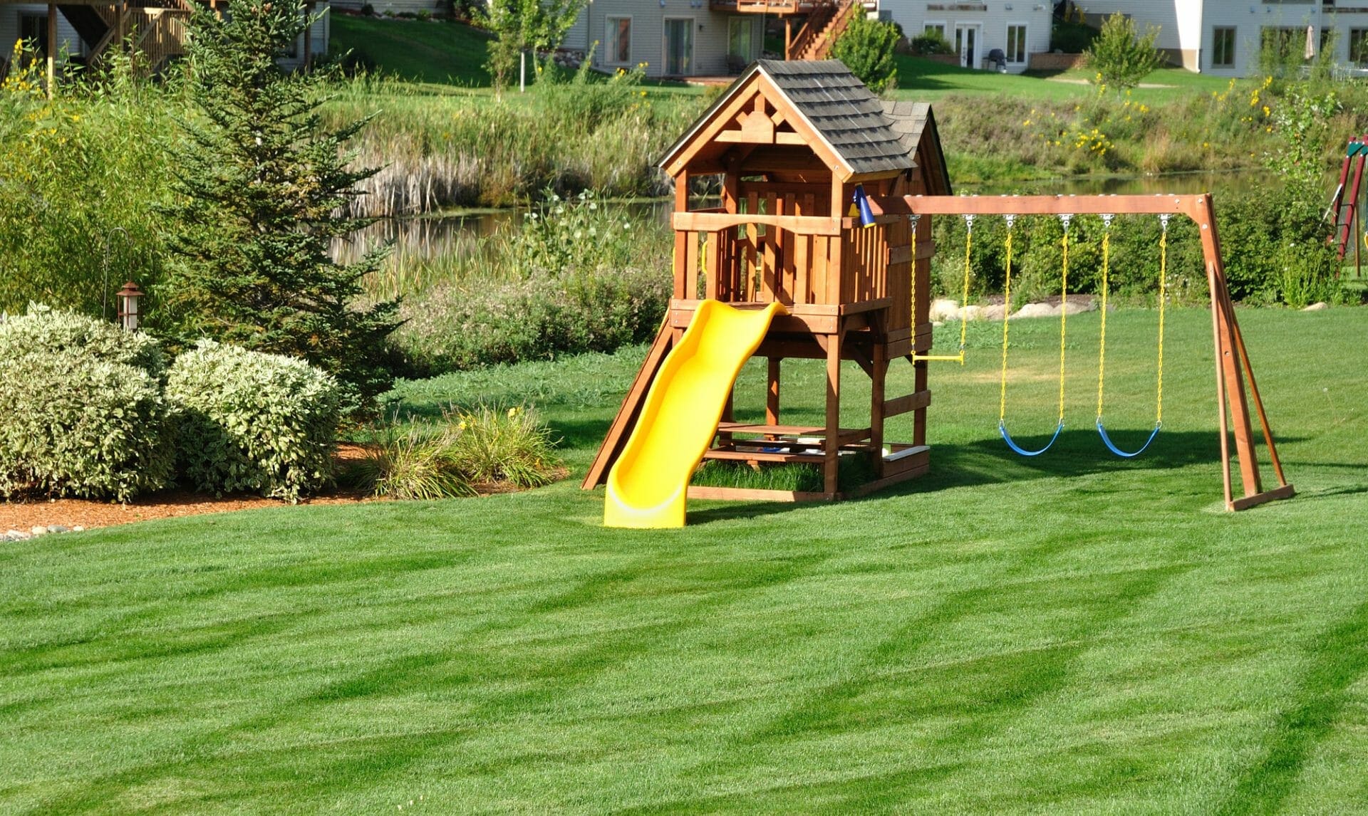 safe clean cut yard with swing set